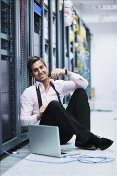 Image of Technician in Server Room.